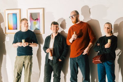 The team at the studio wall